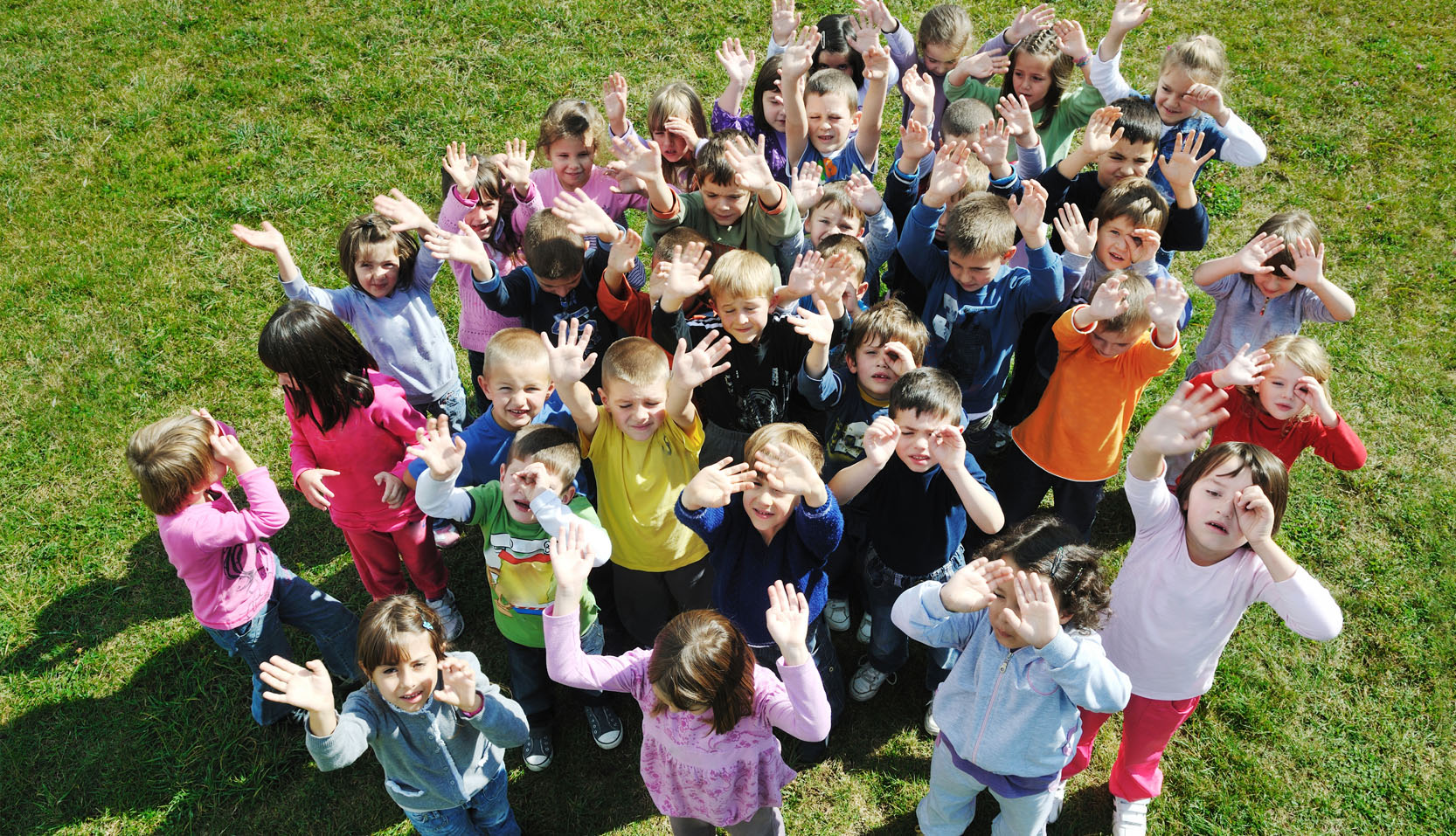 happy kids group with teacher in nature